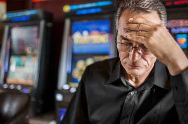 man thinking about slot machines